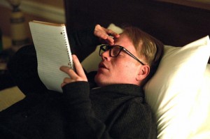 Philip Seymour Hoffman portraying Truman Capote