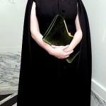 Sultry 'Mad Men' actress Christina Hendricks keeps her sweater kittens under control beneath a dark cape. Personally, I like her vintage...