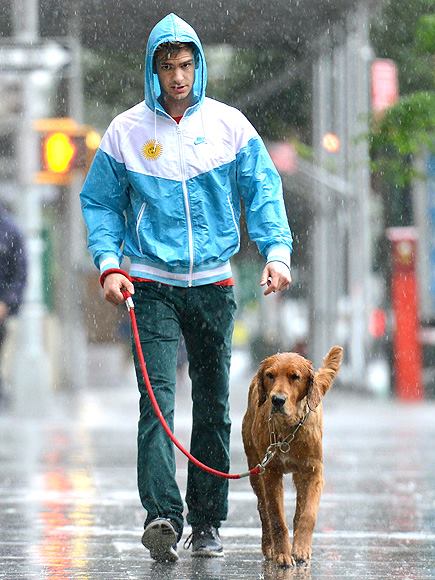 Andrew Garfield and his canine companion get drenched while out on a walk. Good thing his spidey senses told him to wear a jacket…