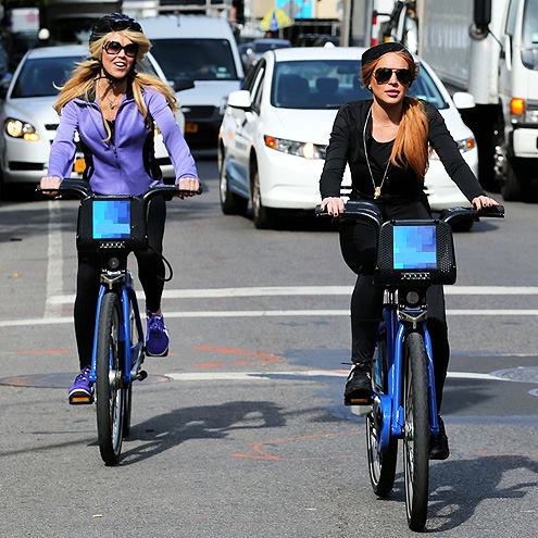 Dina and Lindsay Lohan do something really normal and drama-free… riding bikes. Of course Lindsay is livin’ on the edge with no helmet. 
…