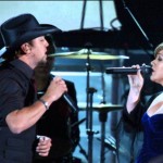 This powerful duet by Kelly Clarkson and Jason Aldean became a hit on both the Pop and Country music charts . . . [Video]