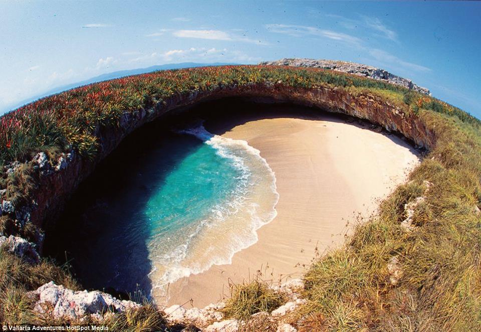 World’s most idyllic bomb site: Hidden beach created by giant blast from Mexican government during target practice is now a stunning strip