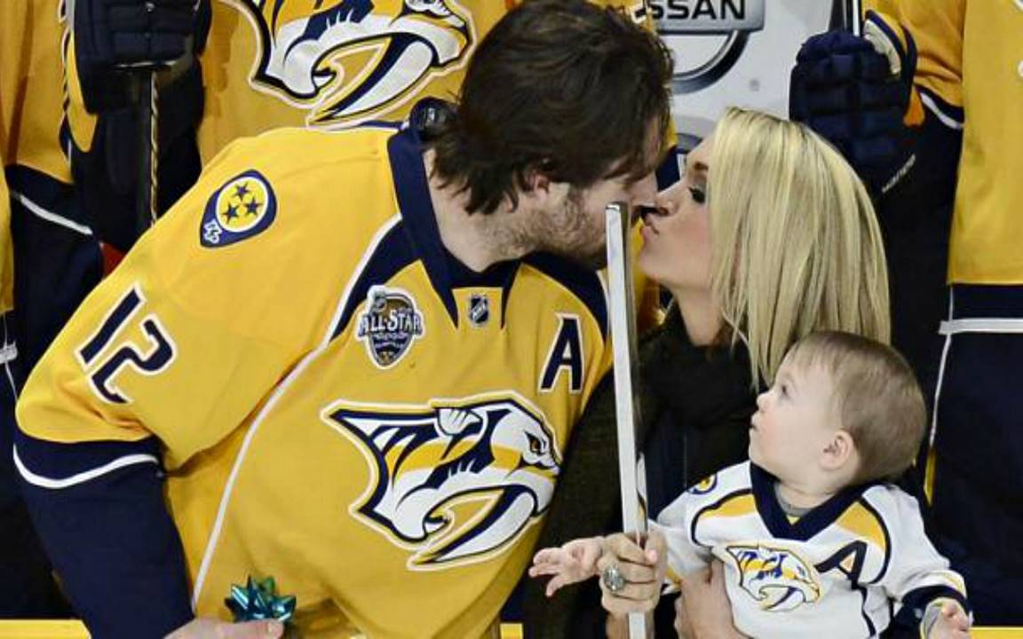 carrie underwood, mike fisher, and isaiah